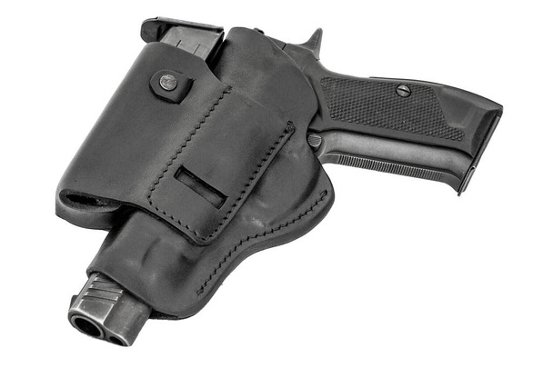 Het pistool in een tactische lederen holster. Geïsoleerd - Foto, afbeelding