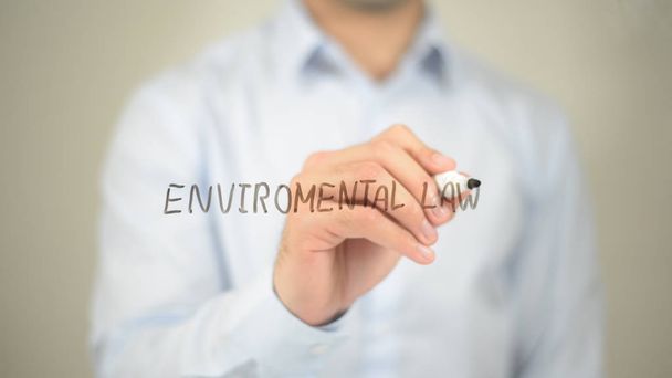 Environmental Law, man writing on transparent screen - Photo, Image