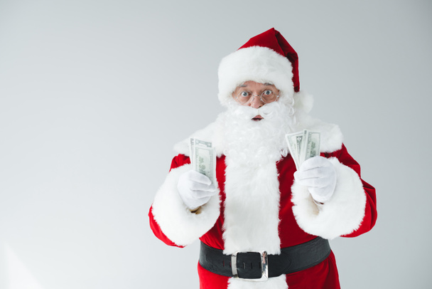 Santa Claus con billetes de dólar
 - Foto, Imagen