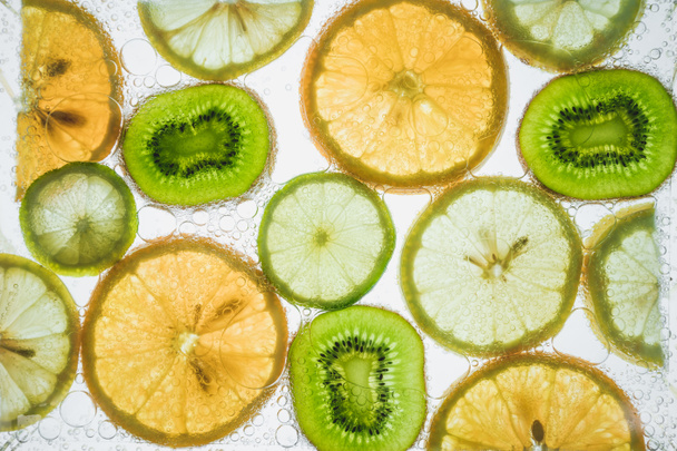 citrus slices floating in water  - Photo, Image
