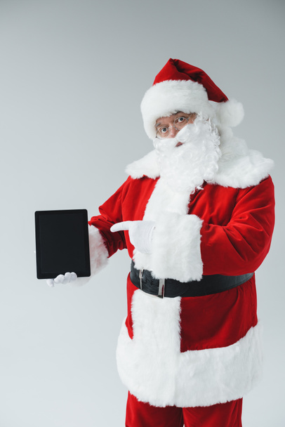 Санта Клаус з цифровим планшетом
 - Фото, зображення