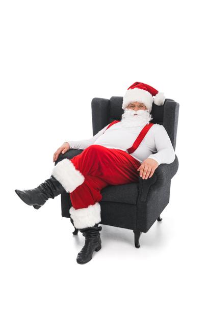 Άγιος Βασίλης κάθεται στην πολυθρόνα - Φωτογραφία, εικόνα