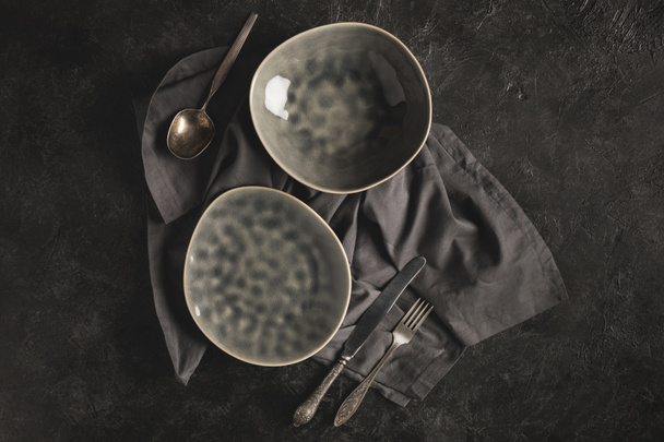 ceramic plates and silverware - Zdjęcie, obraz