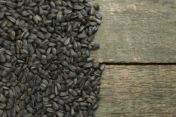 Sunflower seeds on wooden table - Foto, immagini