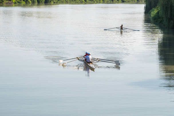 Teenage sportsmen in a boat, rowing on the river Rioni, Poti, Ge - Photo, Image