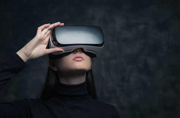 Young woman wearing VR headset - 写真・画像