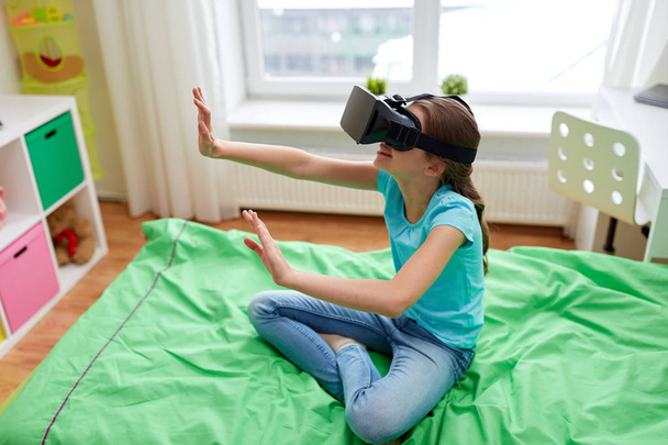 happy girl in vr headset or 3d glasses at home - Photo, Image