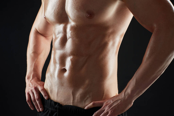 close up of man or bodybuilder with bare torso - Foto, Bild
