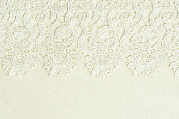 White embroidered lace on white wood - Фото, изображение