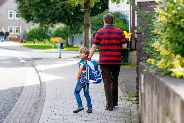 Young father taking child, kid boy to school on his first day - Fotografie, Obrázek