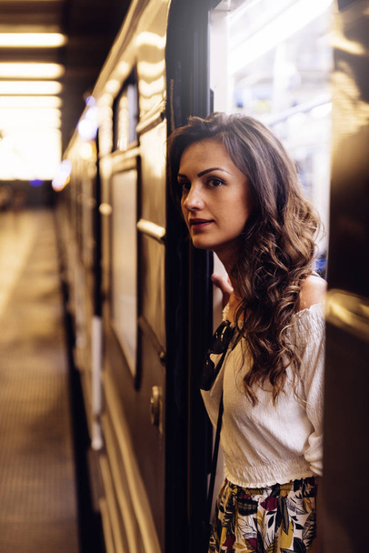 Beautiful woman passenger in the subway of Budapest. - 写真・画像