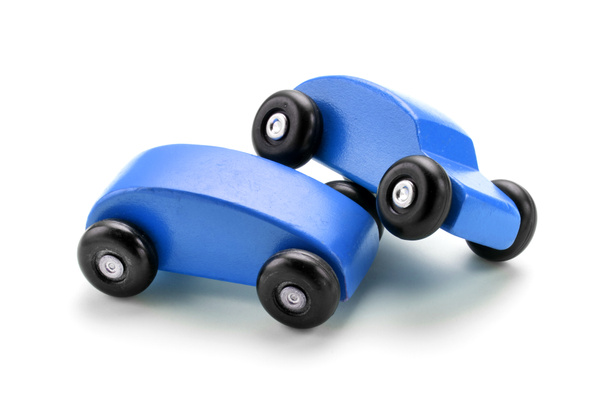 Blue toy car crash against white background - Foto, immagini
