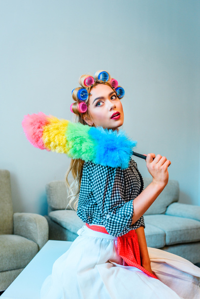 housewife posing with duster  - 写真・画像