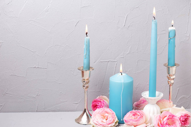 Summer  roses  and burning candles   - Foto, Bild