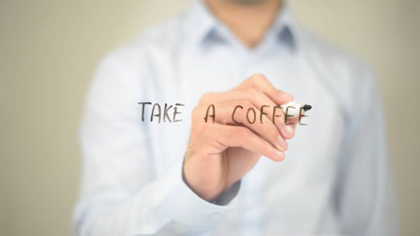 Take a Coffee, Man Writing on Transparent Screen - Photo, Image