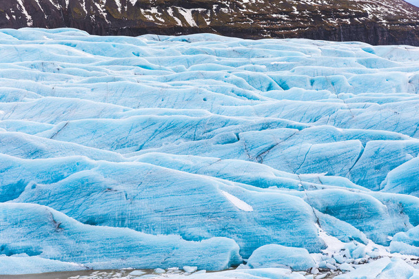 Glacier with blue ice close up in Iceland - Foto, afbeelding