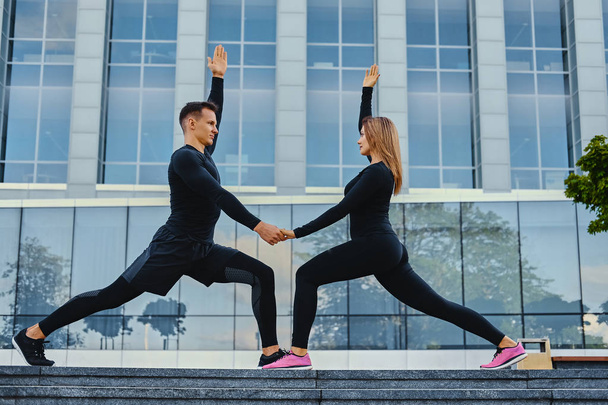 Fitness couple stretching - Photo, Image