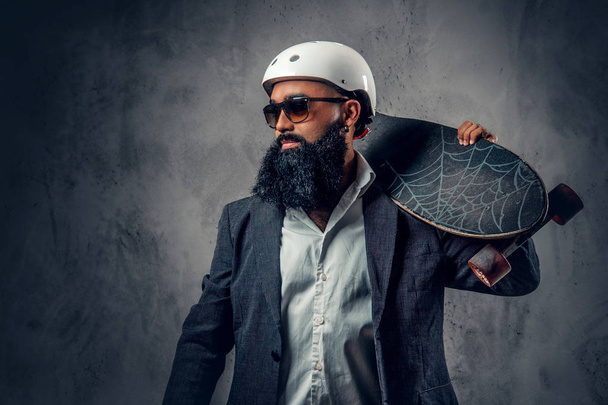 Stylish Arabic male holds long board - Valokuva, kuva