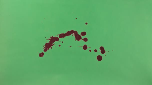 Red Ink Splatter Over Green Screen Background - Footage, Video