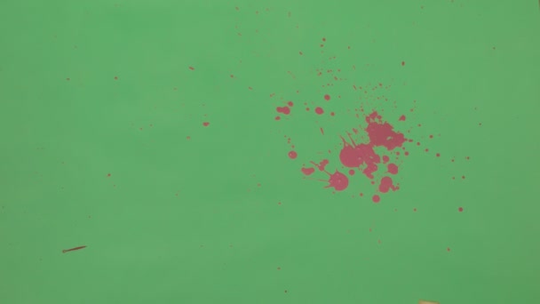 Salpicadura de tinta rosa sobre fondo de pantalla verde
 - Metraje, vídeo