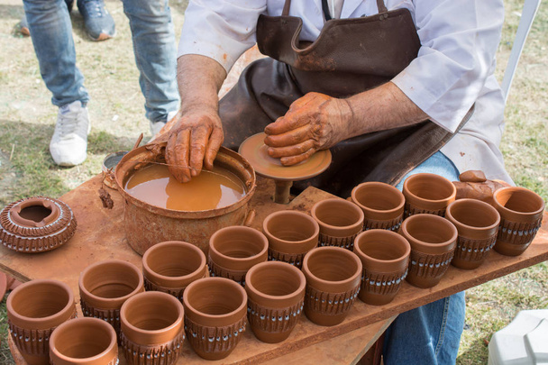 Potter`s hands shaping up the clay - Photo, Image