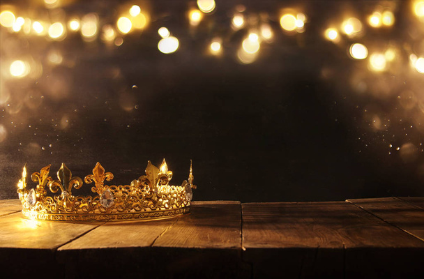 low key of beautiful queen/king crown over wooden table. vintage filtered. fantasy medieval period - Fotografie, Obrázek