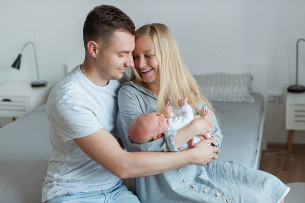 Husband wife and newborn child - Photo, image