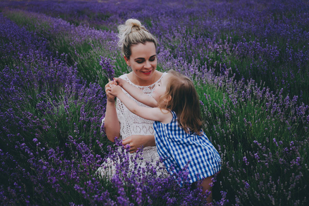 Mom and daughter in lavender. - Fotografie, Obrázek