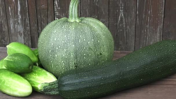 Fresh organic zucchini, cucumber and pumpkin on table - Footage, Video