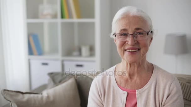 portrait of happy senior woman in glasses at home - Πλάνα, βίντεο