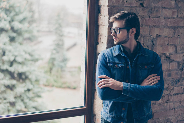 Portrait of young handsome guy with glasses and a jeans jacket i - Фото, изображение