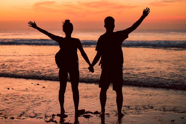 Silhouettes of a couple at sunset  - Photo, Image