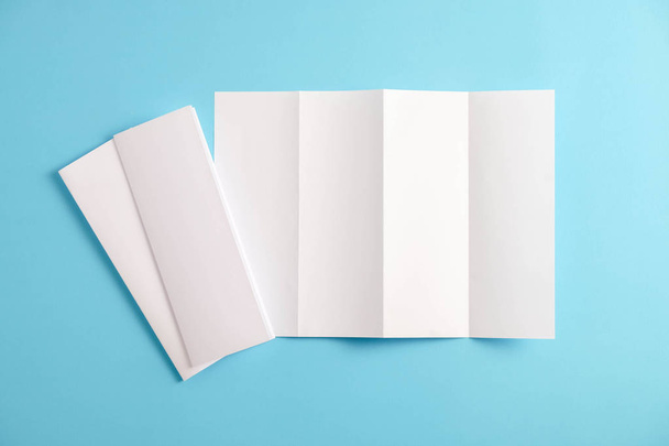 template fold white paper on blue background - Photo, Image