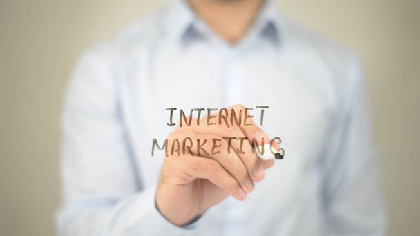 Internet Marketing,  Man writing on transparent screen - Photo, Image