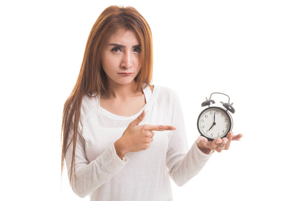 Angry young Asian woman point to a clock. - Foto, imagen