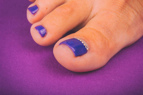 Beautiful female nails on legs - Photo, Image