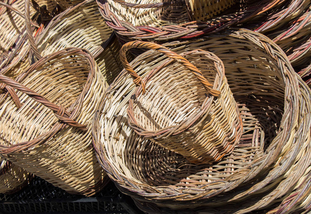 Empty wicker baskets are for sale in a market place - Photo, Image