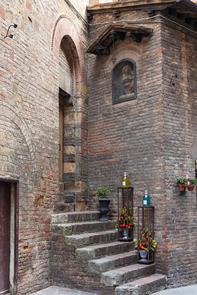 Street stairs near the old house in Siena - Photo, image
