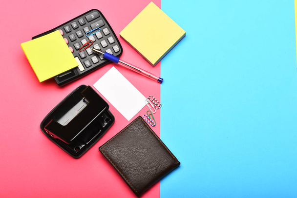 Calculator, hole punch, business card, note paper, pen and clips - 写真・画像