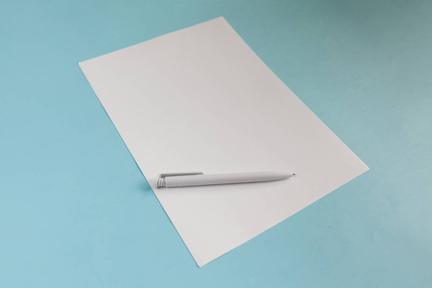 Blank Office Paper A4 Mock-Up on blue background. Close up - Foto, immagini