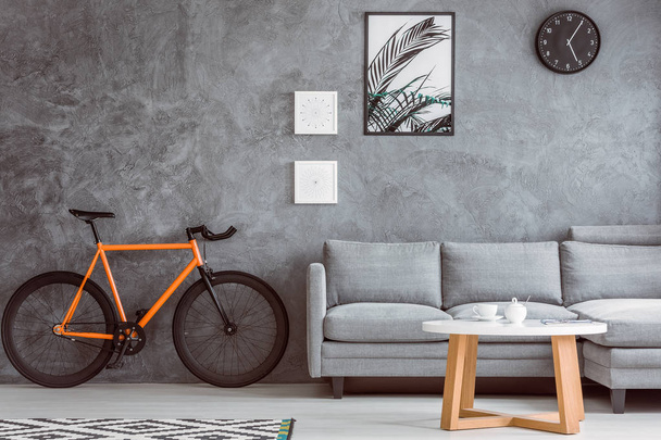 Orange bike in living room - Foto, Bild