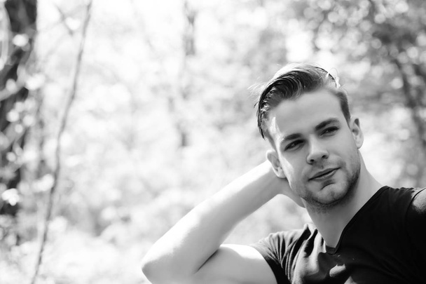Happy young man with smile, stylish haircut and facial hair - 写真・画像
