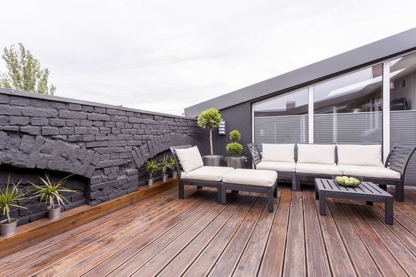 Terrace with black brick wall - Φωτογραφία, εικόνα