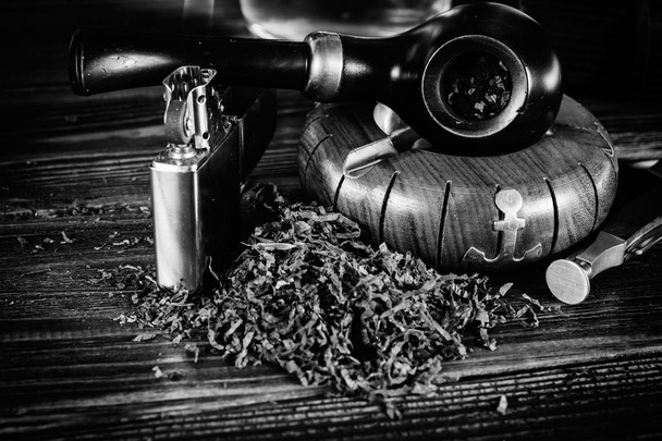 Background smoking pipe on a black and white photo. - Photo, Image