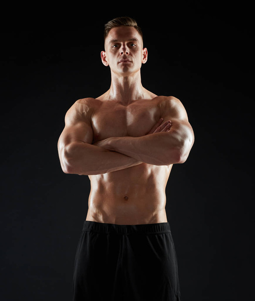 young man or bodybuilder with bare torso - 写真・画像