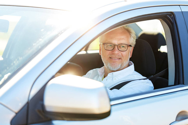 happy senior man driving car with open window - Fotografie, Obrázek