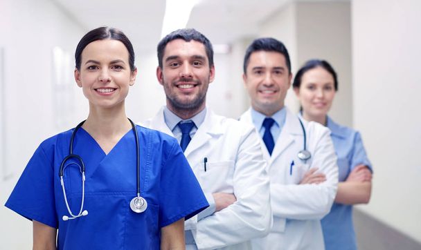 group of happy medics or doctors at hospital - Zdjęcie, obraz