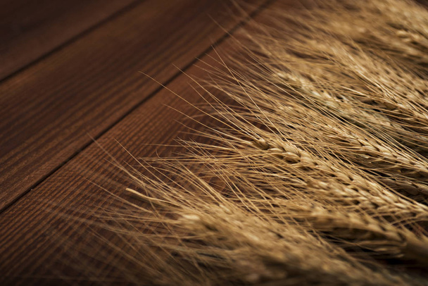wheat on wooden background. top view - 写真・画像