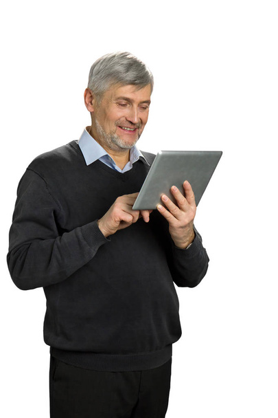 Smiling mature man with pc tablet. - 写真・画像