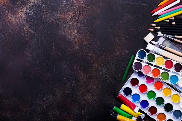 colored paint with school supplies - 写真・画像